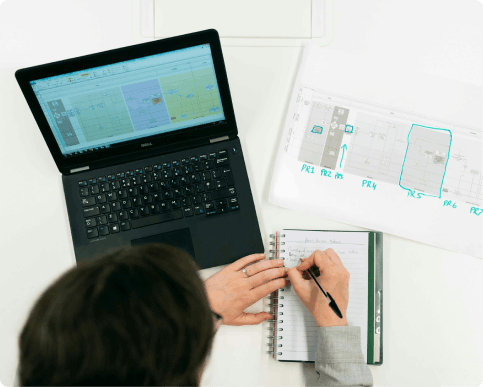 Business planning with laptop and documents