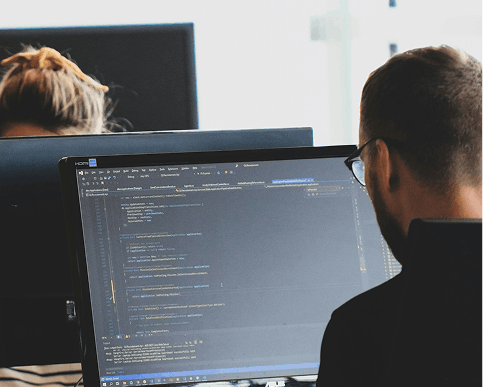 Software developer working on laptop