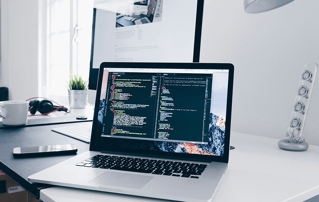 Software development code on laptop screen